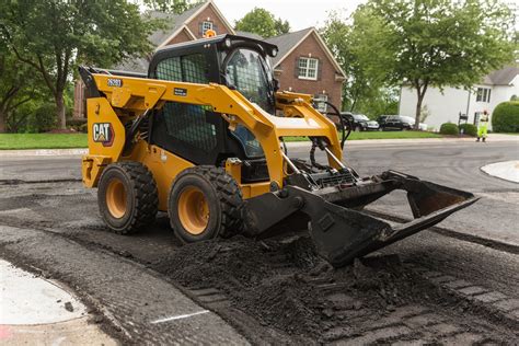 can roads be built with a skid steer|Your guide to CAT skid steer loaders for road maintenance.